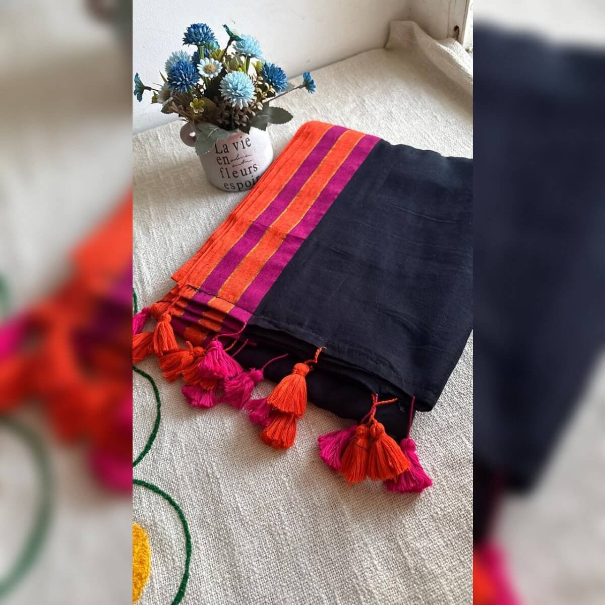 Black mulcotton saree with pink and orange border